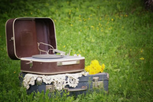 Vintage suitcase Portable Vinyl Player on nature